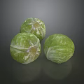 Three Fresh Green Brussels Sprouts With Textured Surface On Dark Background