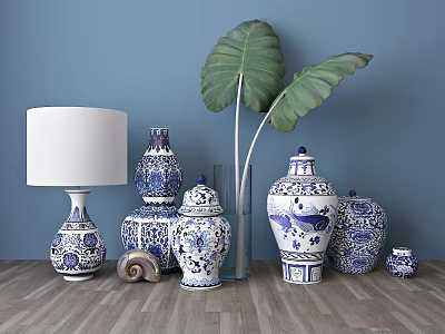 Decorative Blue and White Porcelain Vases Various Sizes With Large Plant Leaves On Wooden Floor 3d model