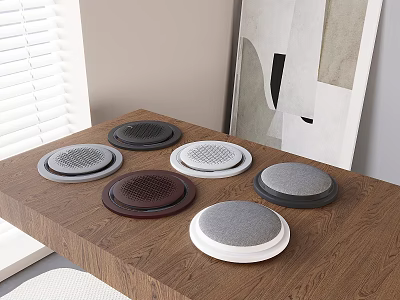Multiple Round Speakers With Various Colors On Wooden Table Indoor Setting 3d model