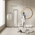 White Clothes On Display Racks With Blue Mannequin And Round Decor In Showroom