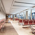 Spacious Service Hall Interior With Red Waiting Chairs Large Windows And Digital Screens