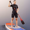 Woman in black wetsuit standing on orange and blue paddleboard holding red and black paddle