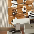 Modern Dark Curved Desk In Study Room With Wooden Bookshelf Books Decorations And Potted Plant