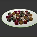 Assorted Chocolates in Red Brown White Colors and Various Shapes on White Plate