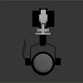 Black Mechanical Clamp Device With Cylindrical Base And Cable On Smooth Surface
