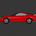 Red Two Door Sports Car With Rear Spoiler Silver Wheels And Reflection