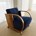 Blue Velvet Armchair With Curved Wooden Armrests And Light Wooden Floor