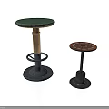 Two Stylish Stools Featuring Green And Red Patterned Seats With Metal Bases