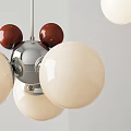 Modern Chandelier Design With White Spheres Red Accents And Silver Metal Frame For Interior Decor