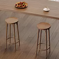 Wooden Bar Stools With Metal Legs Under Wooden Counter And Fruit Plate Coffee Cup
