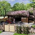 Rustic Wooden Homestay Building with Wooden Gate and Pink Flowering Tree in Green Surroundings