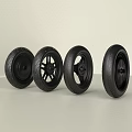 Set of Four Different Black Bicycle Tires Displayed on Light Background