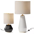 Two Stylish Table Lamps With Textured Bases And Beige Fabric Shades