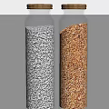 Two Glass Spice Jars With Gold Lids Filled With White And Brown Spices On Surface