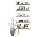 Various Decorative Photo Frames Arranged On Wall Shelves With Vases And Branch Decor