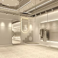 Modern Clothing Store With White Interior Mannequins Hanging Clothes Green Plant And Bright Lighting