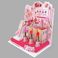 Pink Display Shelf With Cherry Blossom Decoration And Lipsticks Product Display Setup