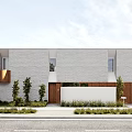 Modern Single Family Home With Gray Facade Windows And Wooden Fence Landscaping