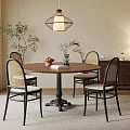Cozy Dining Interior With Round Table Four Chairs Hanging Lamp Potted Plant And Cabinet