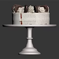 Red Velvet Cake with Cookies and Cream Topping Sliced Side on White Cake Stand
