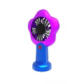 Portable Air Conditioning Fan With Flower Shaped Purple Blades And Blue Base Red Button