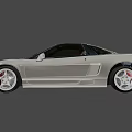 Sleek Silver Two Door Sports Car With Red Seats And Alloy Wheels