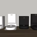 Modern Automatic Pet Feeders in White and Black on Wooden Table with Light Wall Background