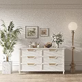 White TV Stand with Drawers Decorative Wall Palm Plant Framed Pictures Flower Arrangement Floor Lamp