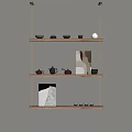 Wooden Wall Shelves With Three Tiers Teapots Teacups Decorations And Books On Beige Wall