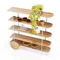 Wooden Multi Layer Curved Shelving Unit With Green Plant Bowls and Book