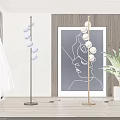 Modern Floor Lamps With Spherical Bulbs In Living Interior With Abstract Art And Green Plant
