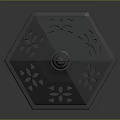 Black Metal Lantern With Intricate Cutout Design And White Candle Inside