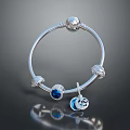Silver Bracelet with Blue Gemstone Charm Pendant and Decorative Metal Beads