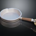 Silver Frying Pan With Wooden Handle And Golden End For Kitchen Use
