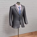 Three Classic Formal Suits On Mannequins With Brick Wall And Wooden Floor