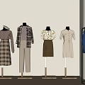 Mannequins Showcase Various Fashion Styles Including Dresses Coats Shirts In Light Wall Clothing Display Area