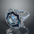 Elegant Silver Ring With Blue Gemstone And Inlaid Crystals Design