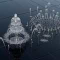 Stunning Fountain Display With Multiple Water Jets Splashing On Black Tiled Ground