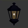 Black Decorative Lantern With Ornamental Top And Warm Yellow Light For Home Decoration