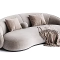 Cozy Beige Sectional Sofa With Curved Design Plush Pillows And Soft Throw Blanket