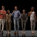 Five Men Standing Together Against Black Background With Different Outfits