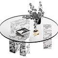 Modern Round Glass Top Coffee Table With Marble Legs And Decorative Vase And Books