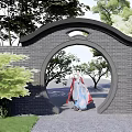 Traditional Chinese Garden Landscape With Brick Moon Gate Green Plants And Person In Traditional Attire