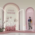 Secret Garden Themed Display With Arched Structures Person On Steps And Flower Decorations