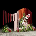 Wedding Decoration Setup With Vertical Red Orange Panels And Floral Arrangement On Wooden Floor