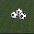 Three Black And White Soccer Balls On Green Grass Sports Equipment