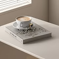 Cozy Reading Book Display With Latte Coffee Cup Saucer And Decorative Beads On White Table