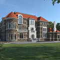 Detached Villa With Red Roof Stone Walls Arched Windows Surrounded By Green Trees And Lawn