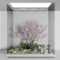 Indoor Garden Decor With Pink Flowering Tree Green Plants Figurines And Stone Lantern Under Skylight