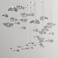 Silver Leaf Shaped Chandeliers Hanging In Irregular Layered Arrangement On White Background 3d model